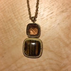 Amber and tiger eye gold tone pendant